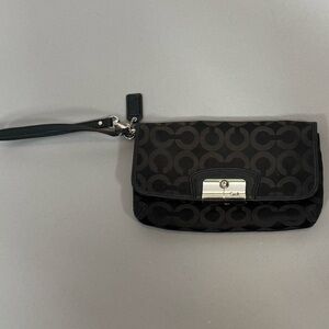 Coach wristlet black with light blue inside